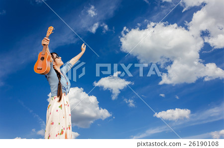 Asian women smiling happily holding ukulele 26190108