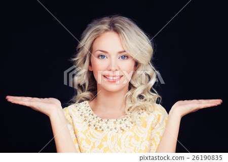 Friendly Woman smiling and showing her hands Friendly Woman smiling and showing her hands 26190835