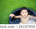 cute baby boy taking water procedures in summer garden 26197956
