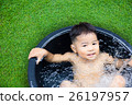 cute baby boy taking water procedures in summer garden 26197957