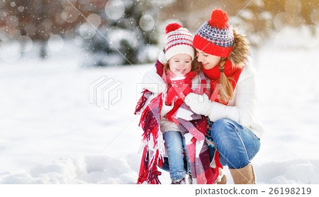 happy family mother and child on winter walk drinking tea happy family mother and child on winter walk drinking tea 26198219