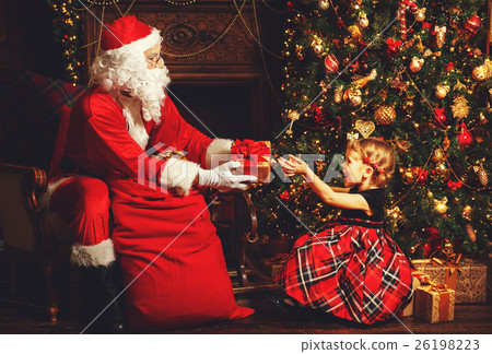 Santa Claus presents Christmas gift happy child Santa Claus presents Christmas gift happy child 26198223