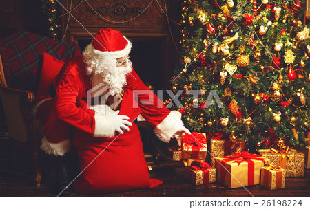 Santa Claus with gifts around Christmas tree Santa Claus with gifts around Christmas tree 26198224
