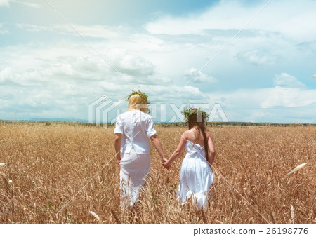 mother and daughter in the wheat field 26198776