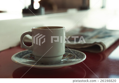 Cup of coffee with newspaper in cafe 26198820