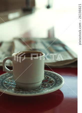 Cup of coffee with newspaper in cafe 26198821
