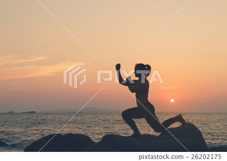 Silhouette woman exercise muay  thai boxing 26202175
