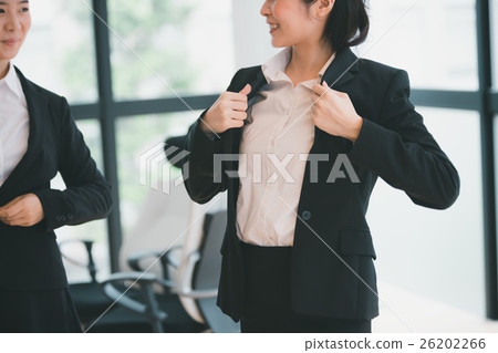 a businesswoman, ol, getting dressed 26202266