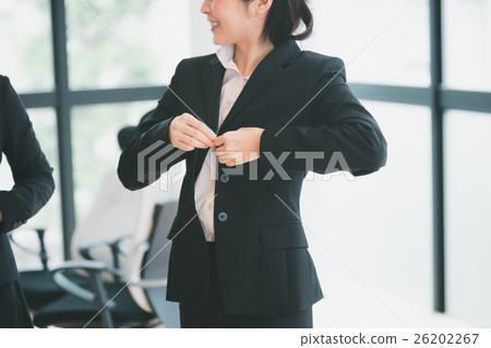 a businesswoman, ol, getting dressed 26202267