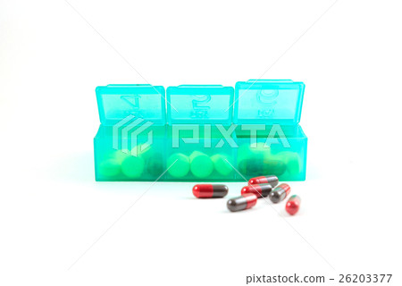 Green plastic daily pill organizer shot  26203377
