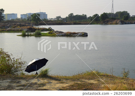 rocky lake with small river islet 26203699