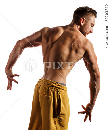 Bodybuilder Posing. Muscles of the back and arms. Bodybuilder Posing. Muscles of the back and arms. 26203740