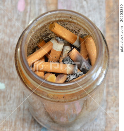 cigarette filter in glass bottle 26203880