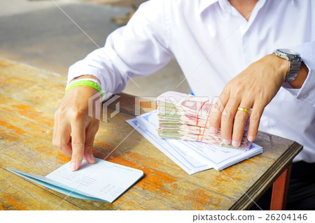 counting money and Deposit account on wood 26204146