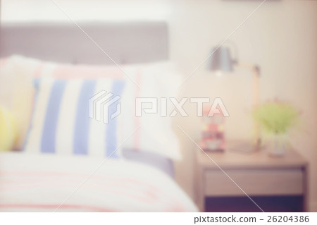 blur image of colorful pillows and reading lamp 26204386