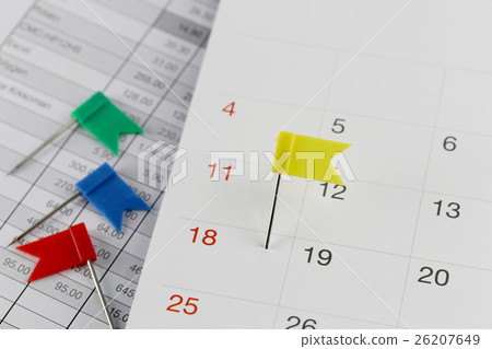 Yellow Pins to Wildcats on the calendar beside the number of eighteen. 26207649