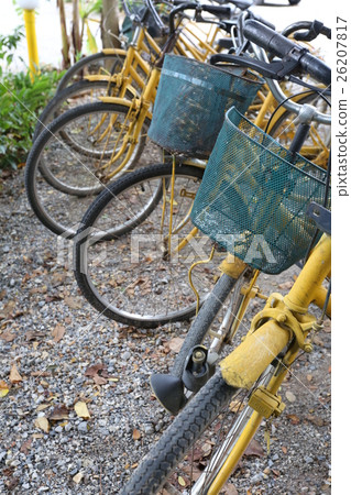 Old yellow bicycle parked. Old yellow bicycle parked. 26207817