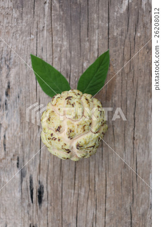 fresh custard apple or sugar apple on old wooden floor. 26208012