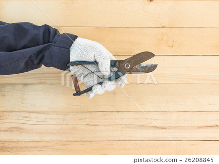 Hand in glove holding plier Hand in glove holding plier 26208845