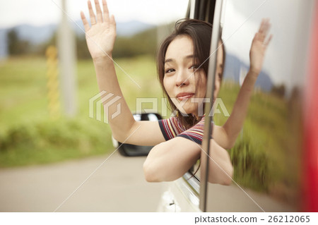 A woman waving a hand 26212065