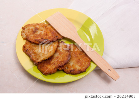 Potato pancakes with meat on green plate Potato pancakes with meat on green plate 26214905