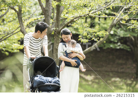 Babies and parents taking a walk in the park Babies and parents taking a walk in the park 26215315