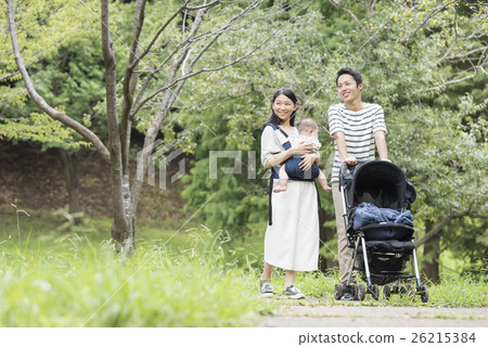 Babies and parents taking a walk in the park 26215384