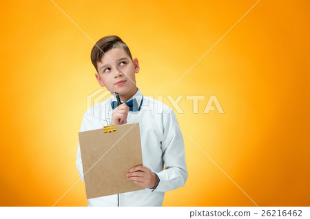 The boy with pen and tablet for notes The boy with pen and tablet for notes 26216462