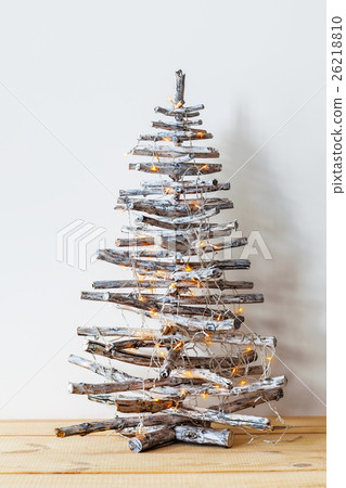 Christmas tree made of wooden branches Christmas tree made of wooden branches 26218810