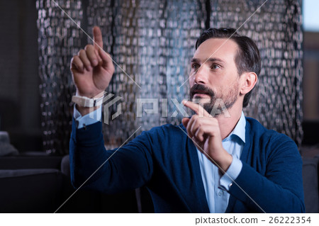 Nice bearded man touching the virtual screen Nice bearded man touching the virtual screen 26222354