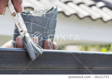 Hand with paintbrush painting steel. Hand with paintbrush painting steel. 26222755