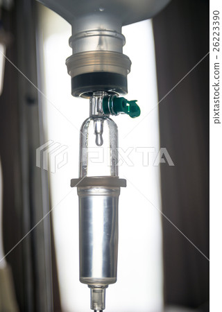 Close up IV saline solution drip for patient 26223390