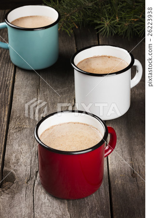 Cup of hot cocoa on a dark background. Toning 26223938
