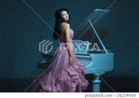 Girl and a big white piano. 26224430