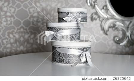Three round celebration gift boxes with silver Three round celebration gift boxes with silver 26225645
