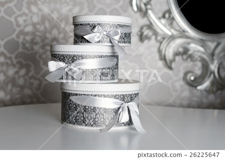 Three round celebration gift boxes with silver 26225647