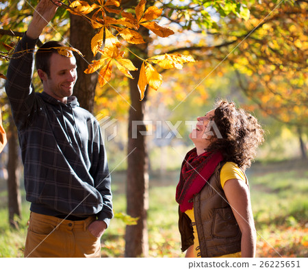 Loving couple having fun in autumnal park Loving couple having fun in autumnal park 26225651