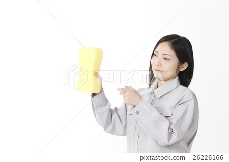 A young lady with a car wash sponge 26226166