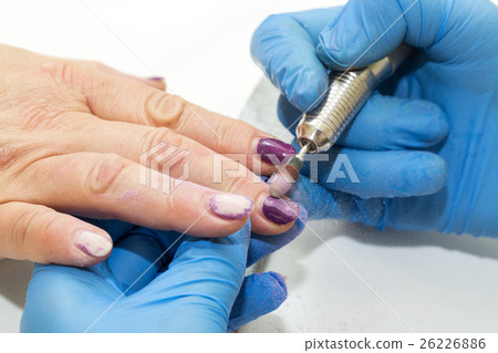 Woman doing manicure beauty salon varnish wellness Woman doing manicure beauty salon varnish wellness 26226886