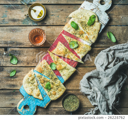 Focaccia with basil leaves, olive oil, wine on Focaccia with basil leaves, olive oil, wine on 26228762