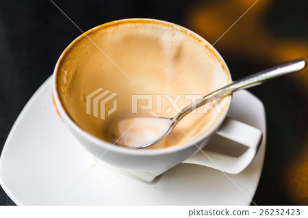 Empty cup of coffee on table . Empty cup of coffee on table . 26232423
