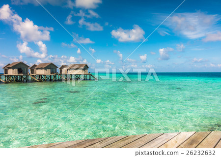 Beautiful tropical Maldives resort hotel with beach and blue water. 26232632