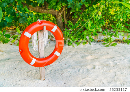 lifebouy or safety ring in maldives resort at the sunrise time . lifebouy or safety ring in maldives resort at the sunrise time . 26233117