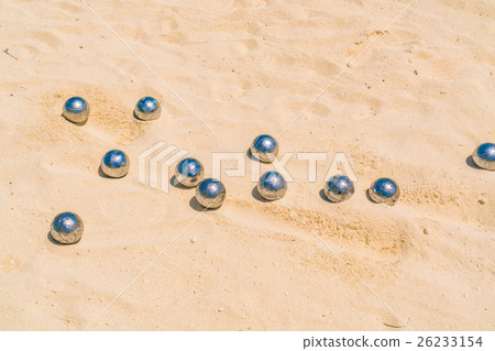 Bocce balls on white sandy beach . 26233154
