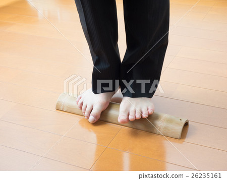 A man with a pain in stepping on a bamboo 26235161