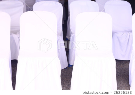 Into a chair covered with a white cloth on the mat Into a chair covered with a white cloth on the mat 26236188
