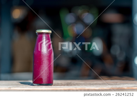 Raw pomegranate juice in glass bottle Raw pomegranate juice in glass bottle 26241252