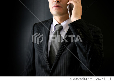 A man who makes a phone call 26241901