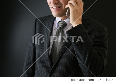 A suspicious man who makes a phone call A suspicious man who makes a phone call 26241902