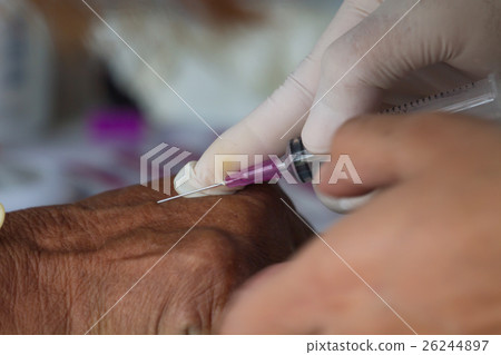 Doctor Injecting Patient, Syringe To Collect Blood 26244897